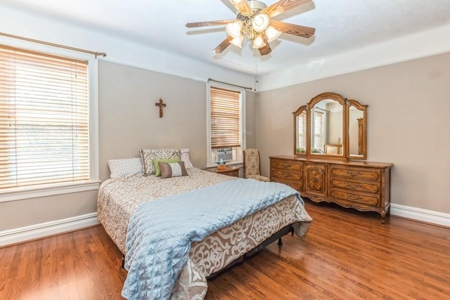 bedroom with ceiling fan and hardwood / wood-style floors