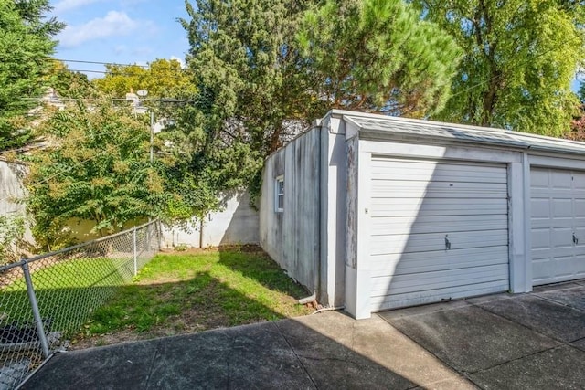 garage with a lawn