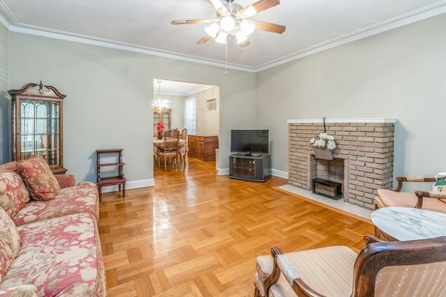 living room with parquet flooring, ceiling fan with notable chandelier, a fireplace, and crown molding