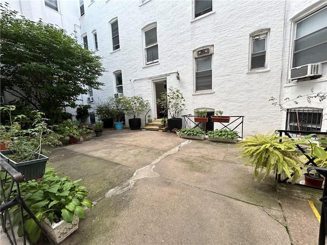 view of patio featuring cooling unit and grilling area