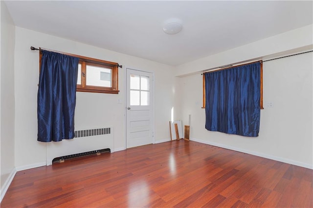 entryway featuring wood-type flooring and radiator heating unit