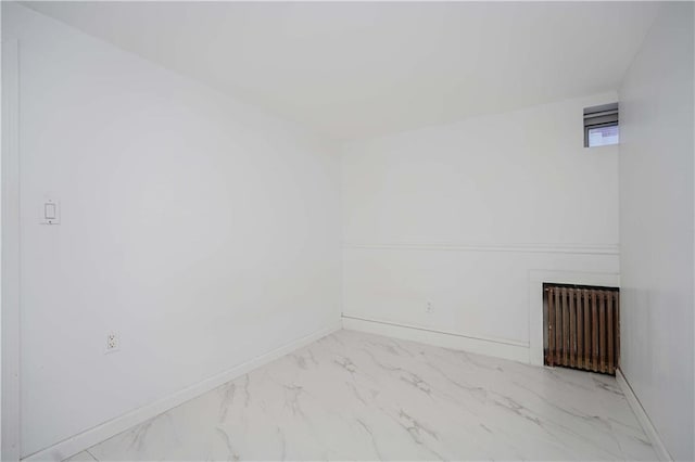 unfurnished room with radiator