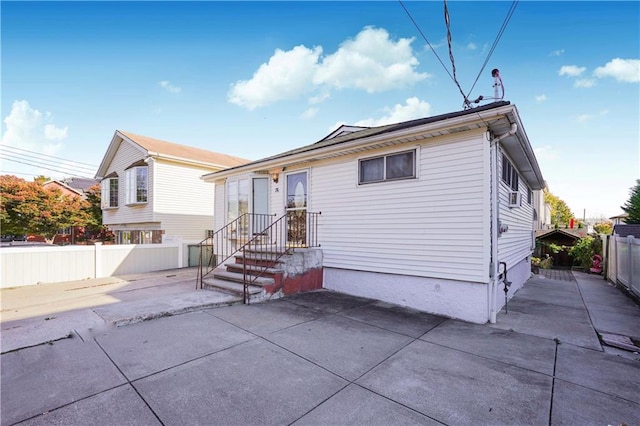 rear view of property featuring a patio area