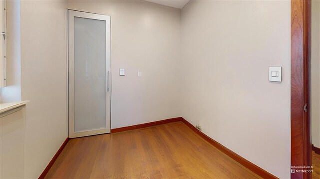 unfurnished room featuring wood-type flooring