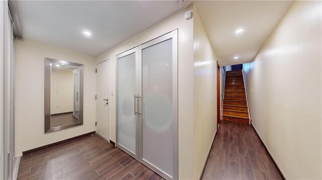 hallway with dark hardwood / wood-style floors