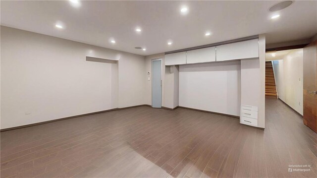 unfurnished bedroom featuring hardwood / wood-style flooring and a closet