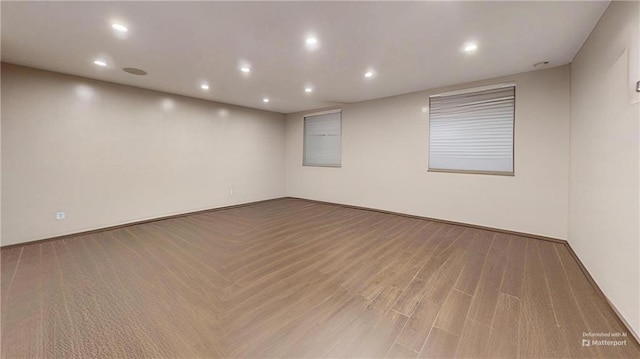 unfurnished room with wood-type flooring