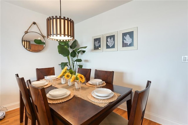 dining area with wood-type flooring