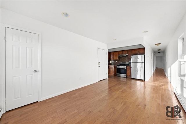 unfurnished living room featuring light hardwood / wood-style floors