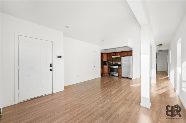 unfurnished living room with light wood-type flooring