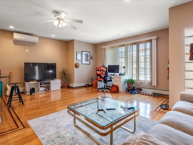 living room featuring wood-type flooring, an AC wall unit, a baseboard heating unit, and ceiling fan