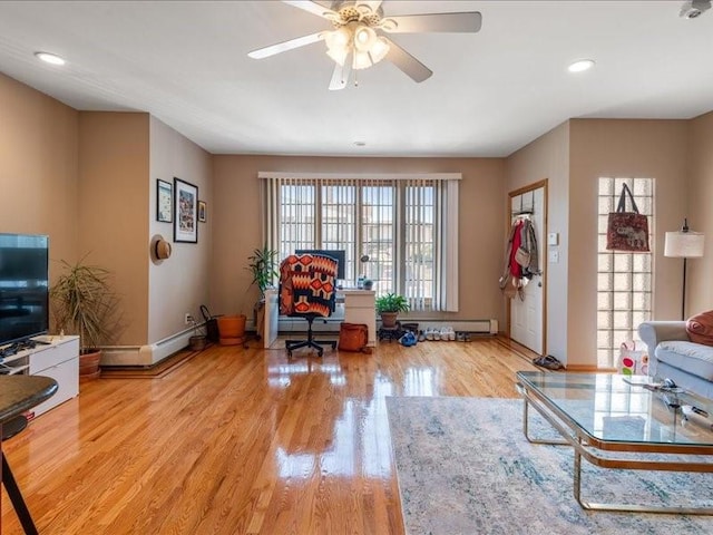 living room with ceiling fan and light wood-type flooring