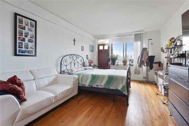 bedroom with wood-type flooring