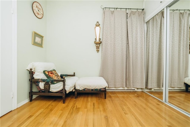 sitting room featuring wood finished floors