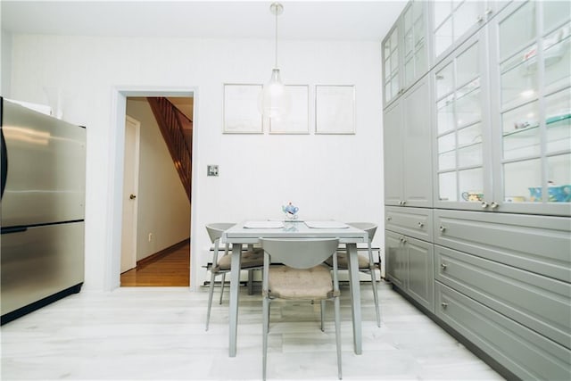 dining area featuring light wood-type flooring