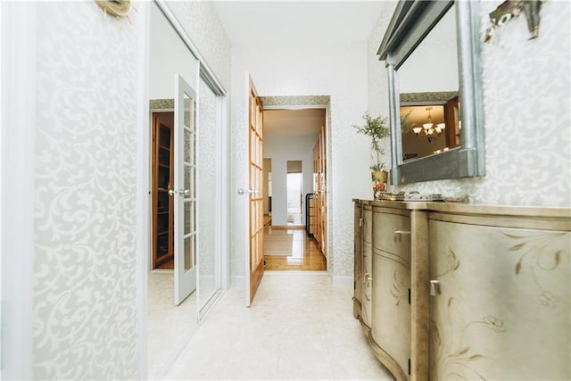 corridor featuring light tile patterned floors