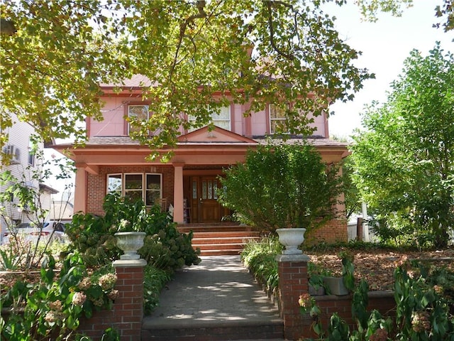 view of front of property featuring covered porch