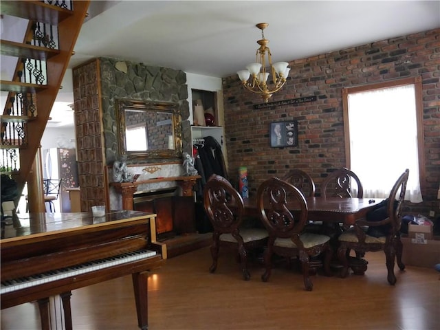 dining area with a notable chandelier and wood-type flooring