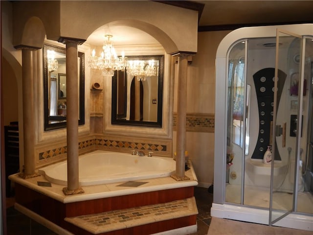 bathroom with shower with separate bathtub and a chandelier