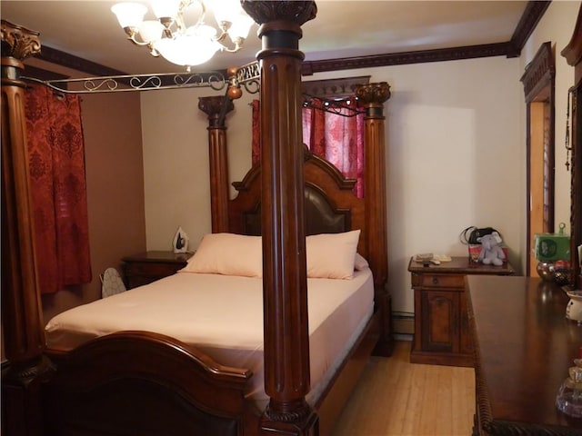 bedroom with an inviting chandelier, light hardwood / wood-style flooring, ornamental molding, and a baseboard radiator