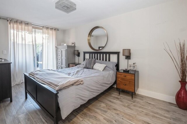 bedroom featuring wood-type flooring