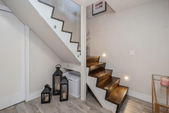 stairway with wood-type flooring