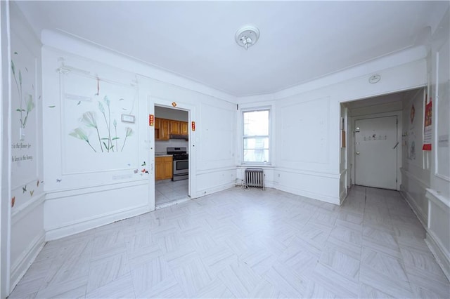 unfurnished living room featuring radiator heating unit