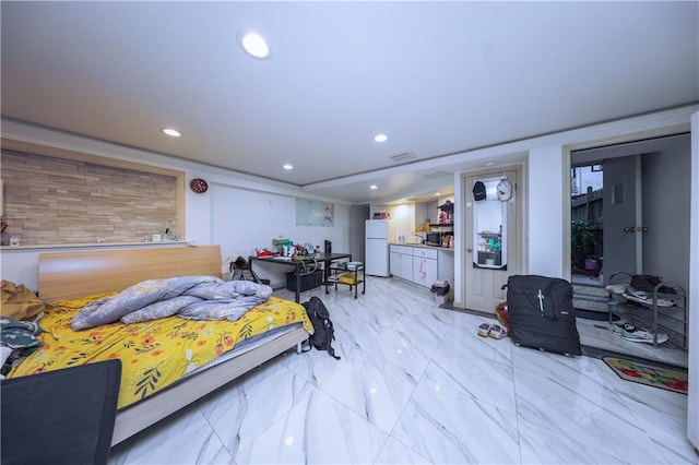bedroom featuring freestanding refrigerator, recessed lighting, and marble finish floor