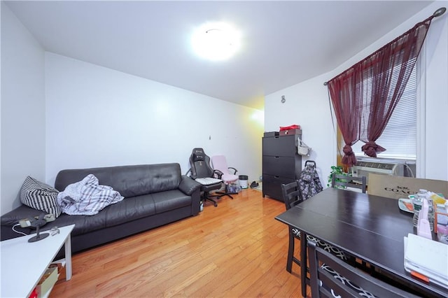 living room with wood finished floors and cooling unit