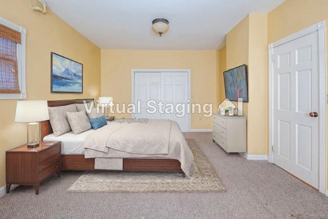 bedroom featuring light carpet and a closet