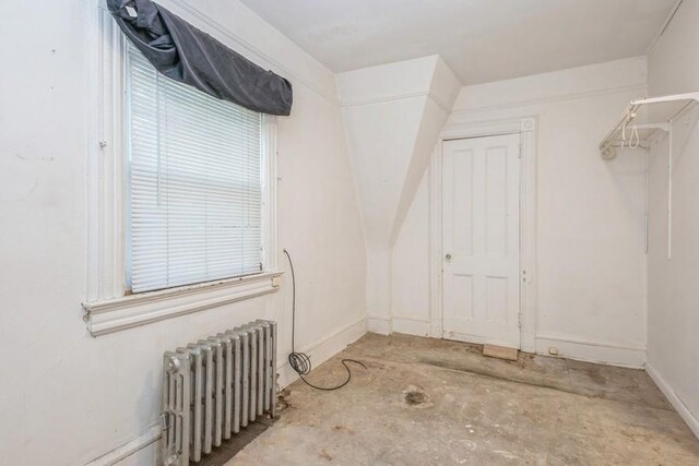 interior space with radiator heating unit and concrete flooring