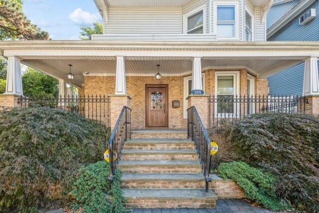 doorway to property featuring a porch