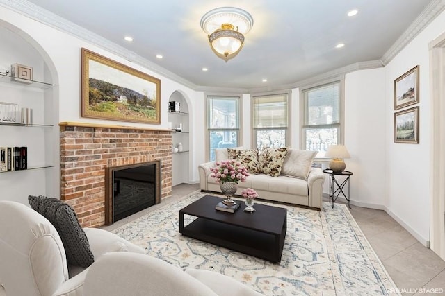 living room featuring ornamental molding, a brick fireplace, built in features, and light tile patterned floors