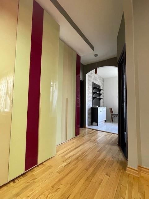 hallway with light hardwood / wood-style flooring