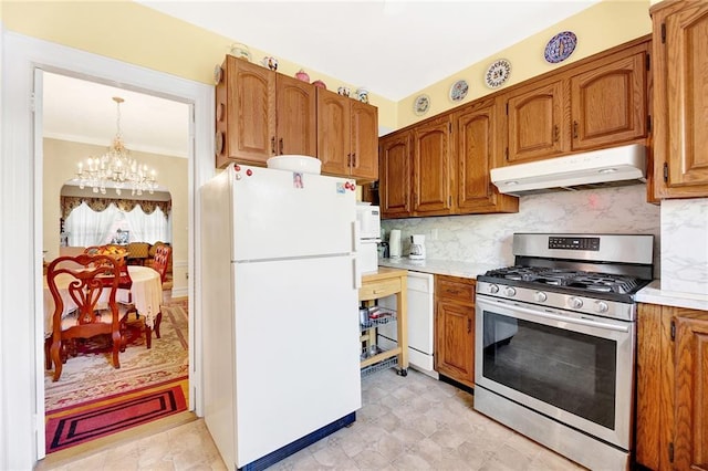 kitchen with backsplash, a chandelier, decorative light fixtures, white appliances, and ornamental molding