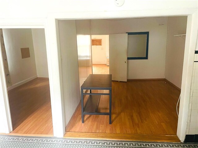 hallway featuring hardwood / wood-style flooring