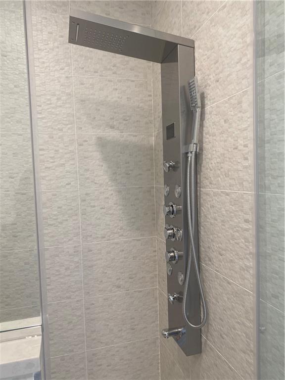 64 Ottavio Promenade, Staten Island, NY 10307 - bathroom view of tiled shower and tile walls