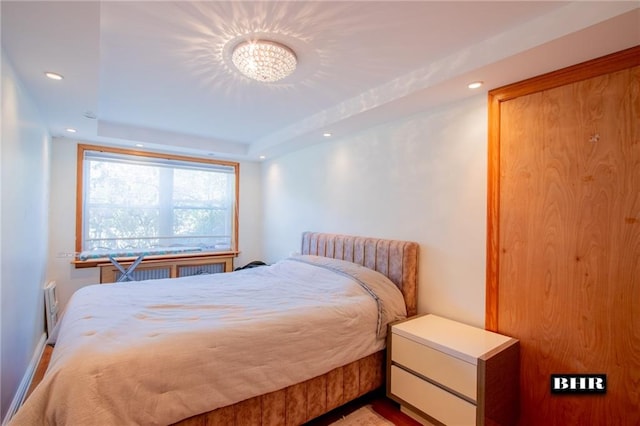 bedroom featuring a tray ceiling