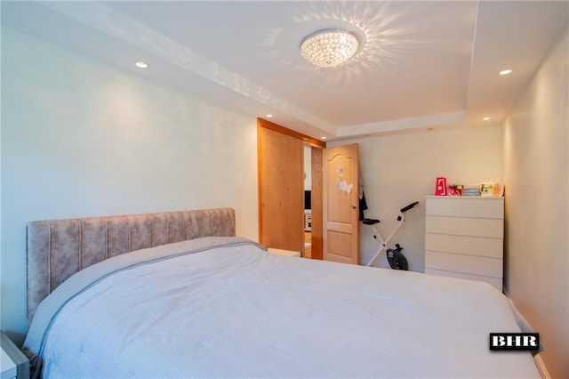 bedroom featuring a raised ceiling