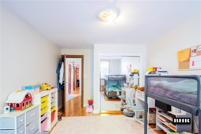 bedroom with light wood-type flooring