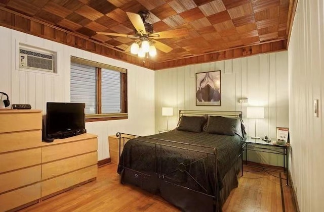 bedroom featuring wood walls, wood ceiling, wood-type flooring, an AC wall unit, and ceiling fan