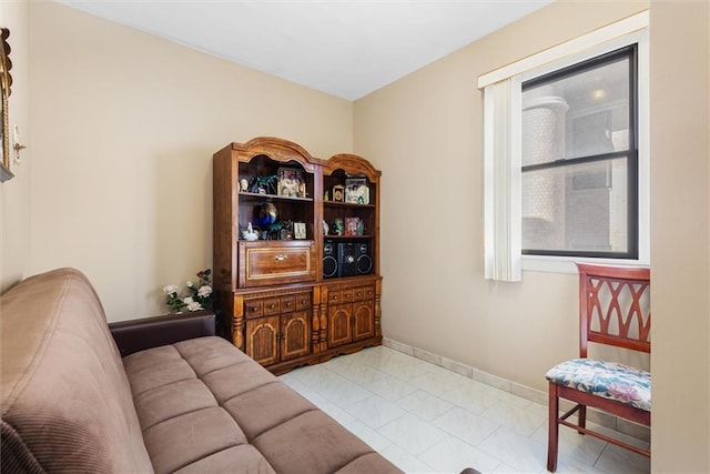 sitting room with light tile patterned floors