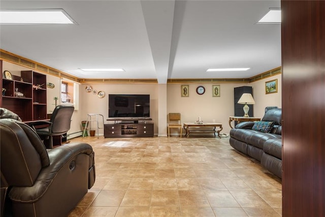 tiled living room featuring a baseboard radiator