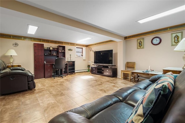 living room with a baseboard heating unit, light tile patterned floors, and a desk