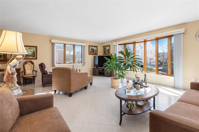 living area featuring light tile patterned flooring