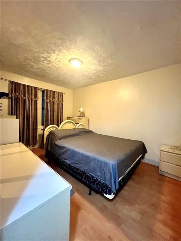 bedroom featuring hardwood / wood-style floors