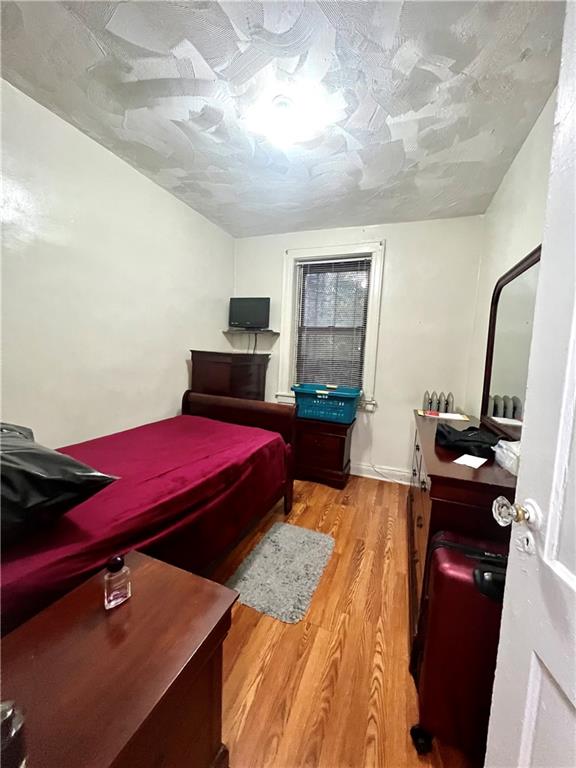 bedroom featuring light wood finished floors
