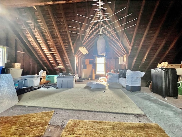 unfinished attic featuring plenty of natural light