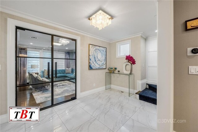 interior space with a chandelier and ornamental molding