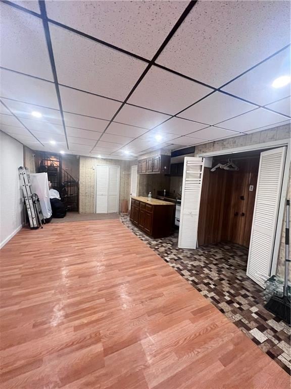 3708 Shore Pkwy, Brooklyn, NY 11235 - bar featuring wood finished floors, a paneled ceiling, and wooden walls